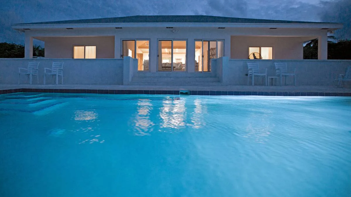 The house at dusk from the pool