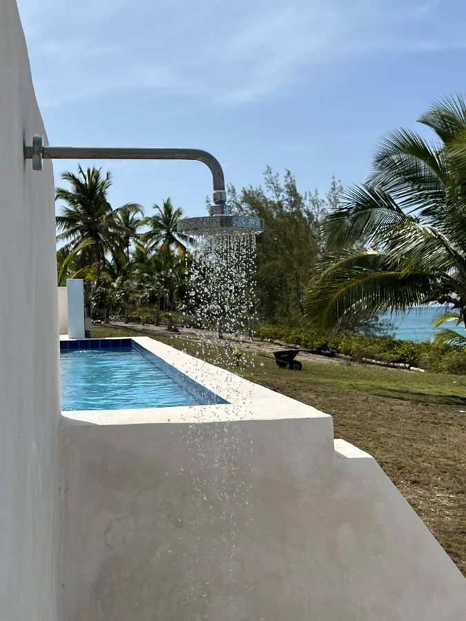 The pool and lawn looking out to the ocean